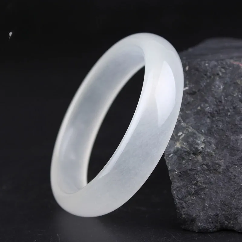 Gao bing jade bracelet in ice-white with flat rod and round rod style options on a wrist
