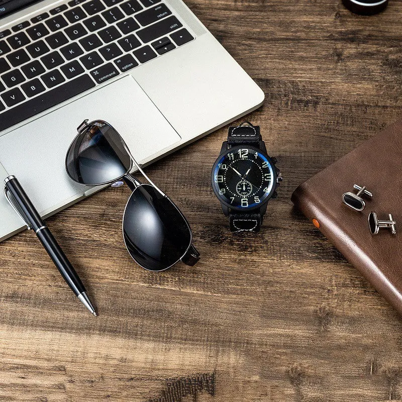 Men's gift set with brown leather watch, sunglasses, pen, and cufflinks in a gift box