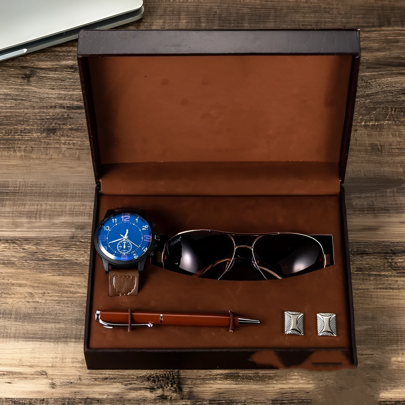 Men's gift set with brown leather watch, sunglasses, pen, and cufflinks in a gift box