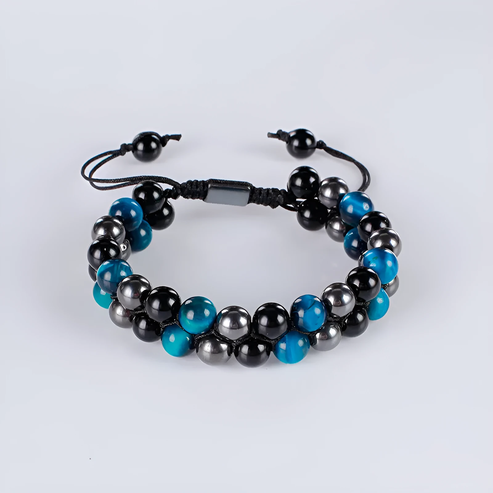 Handmade alloy bracelet with tiger's eye beads and an auspicious elephant charm in multiple colour options.