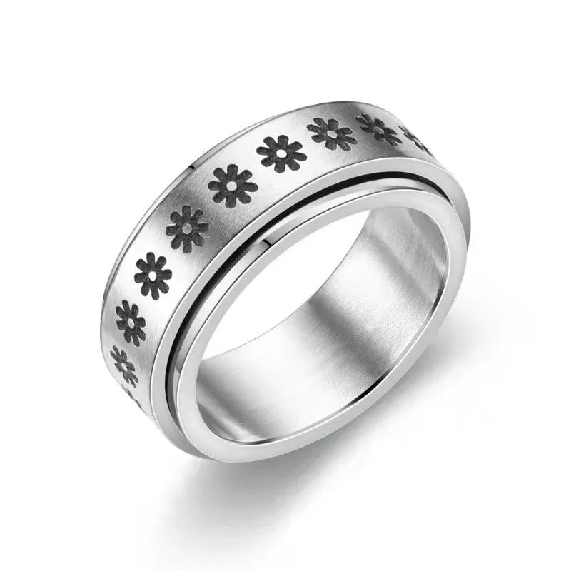 Stars And Moon geometric stainless steel rotatable ring in black star moon finish on a plain background