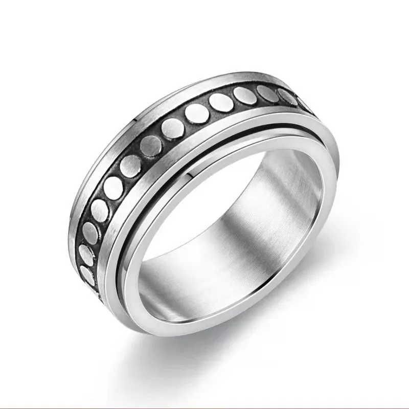 Stars And Moon geometric stainless steel rotatable ring in black star moon finish on a plain background