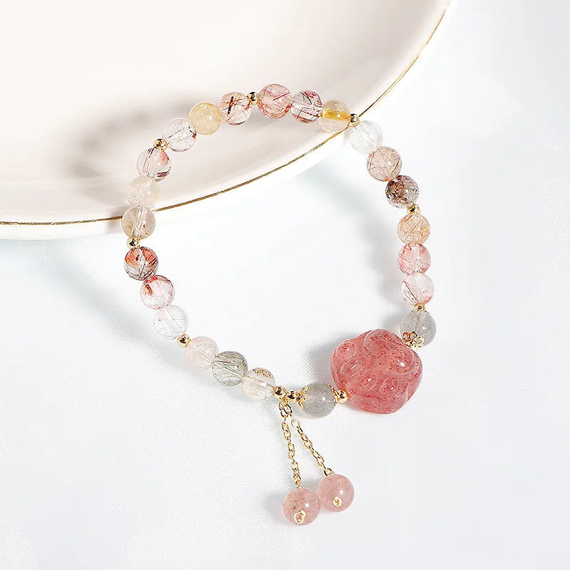 Women's natural crystal bracelet with manual craftsmanship showing animal zodiac designs