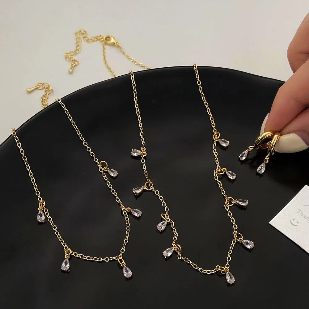 Zircon jewellery set showing necklace, earrings, and anklet with geometric meteor shower design