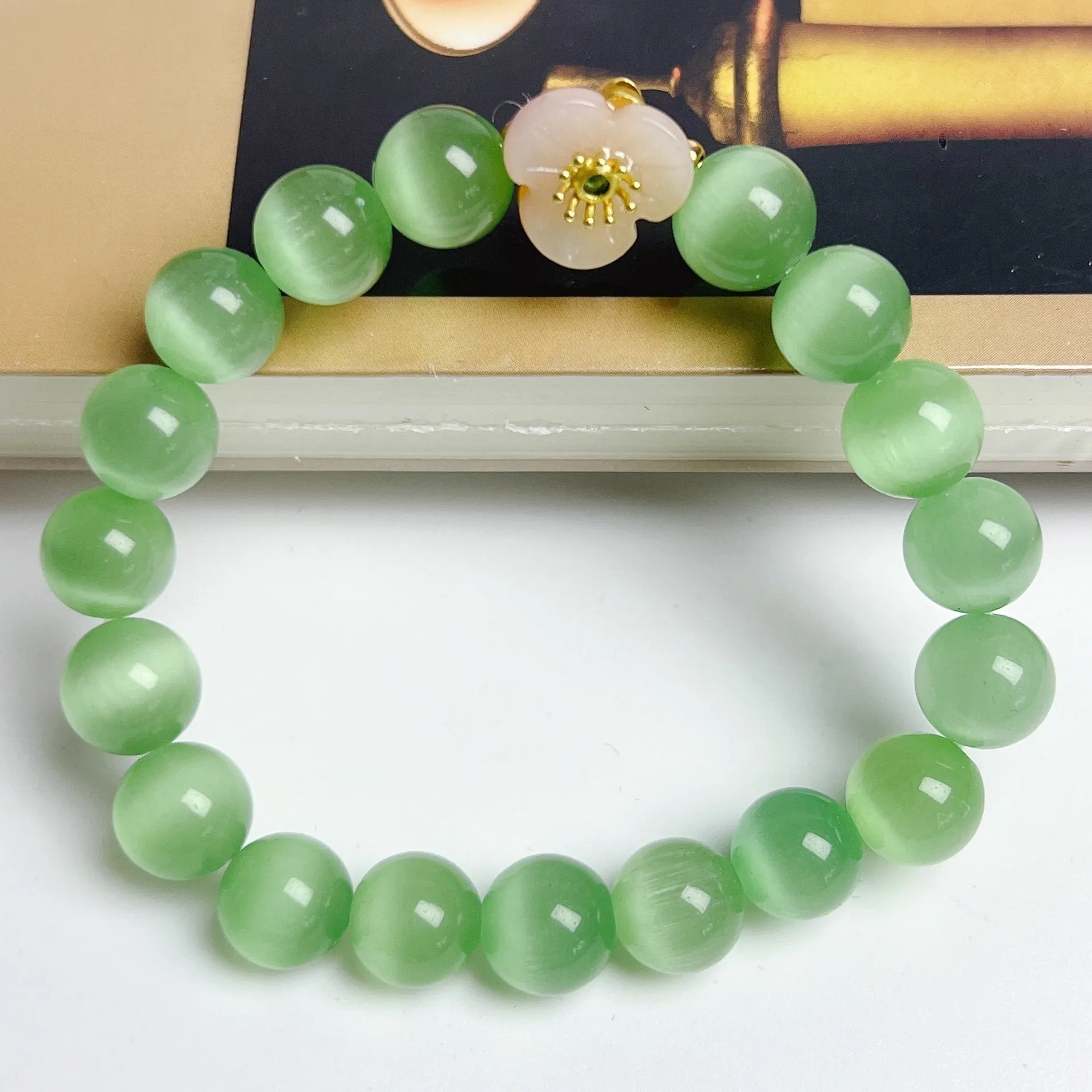 Handmade glass bracelet with flower beads in yellow, pink, white, green colours