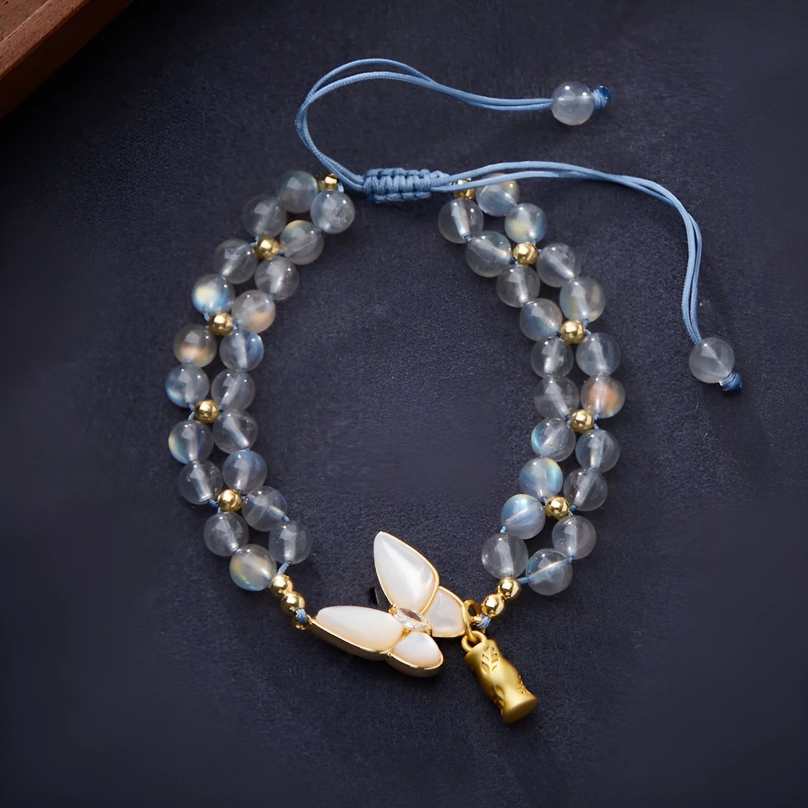 Gray moonstone woven bracelet for women with butterfly hand rope design and geometric retro style