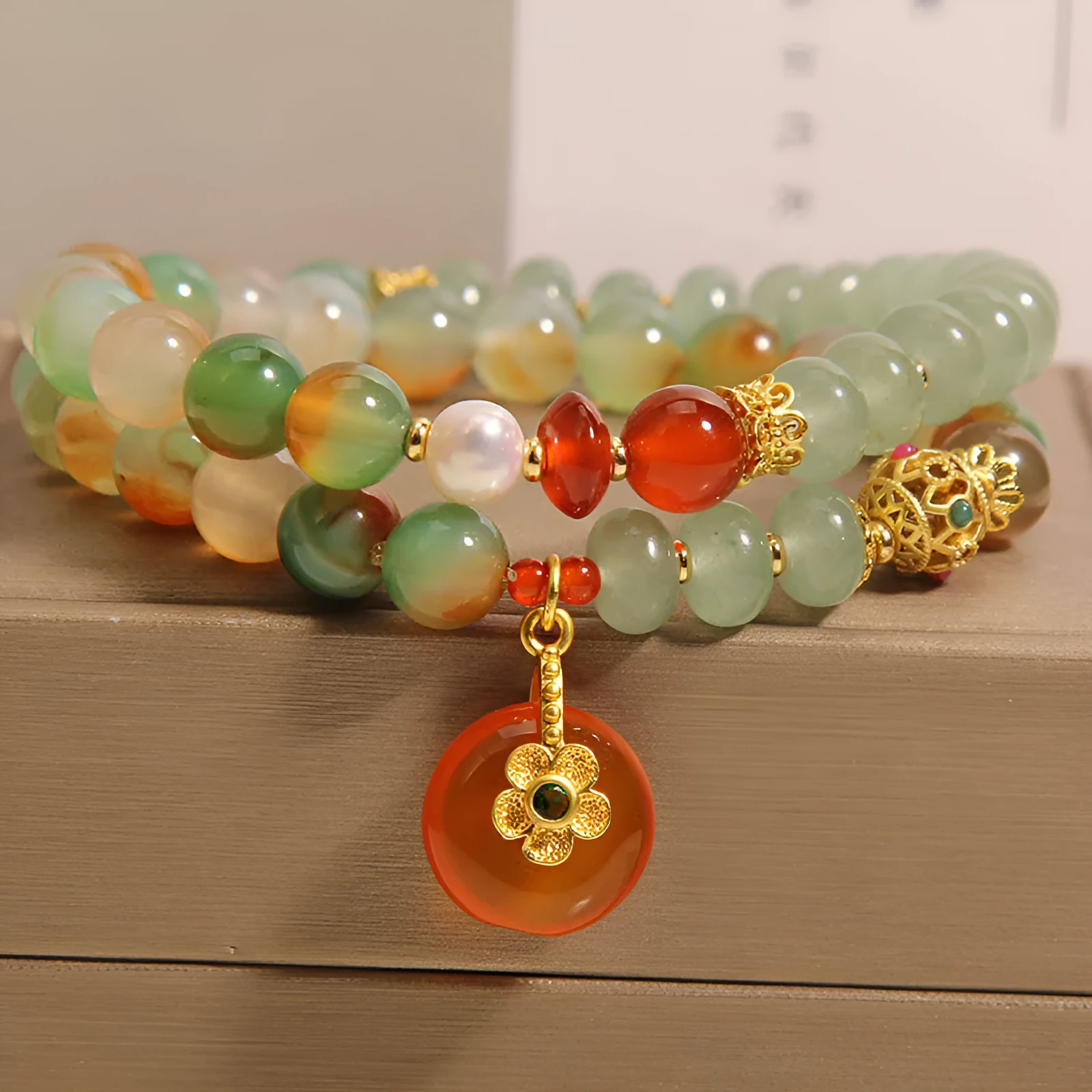 Women's peacock green agate double ring bracelet with safety buckle closure and rhinestone accents