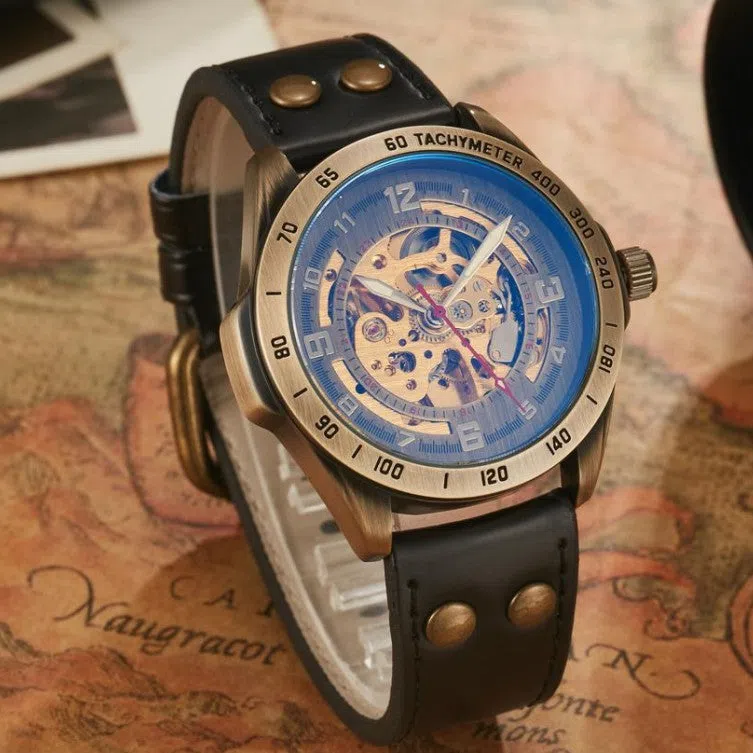 Men's automatic mechanical watch with hollowed-out round dial, 42mm alloy case, genuine leather strap, and transparent case back