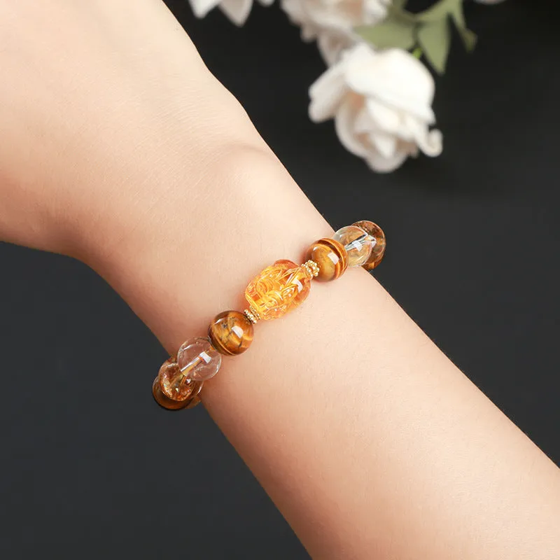 5A natural yellow tiger's eye and citrine bracelet with 10mm geometric beads and a beeswax pi xiu charm.