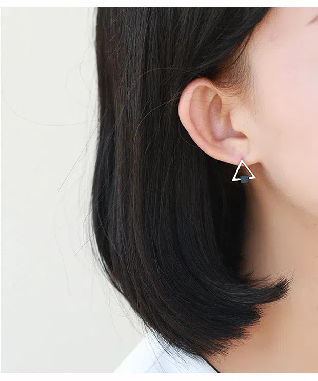 Sterling silver S925 geometric triangle black earrings with gem inlay on neutral background