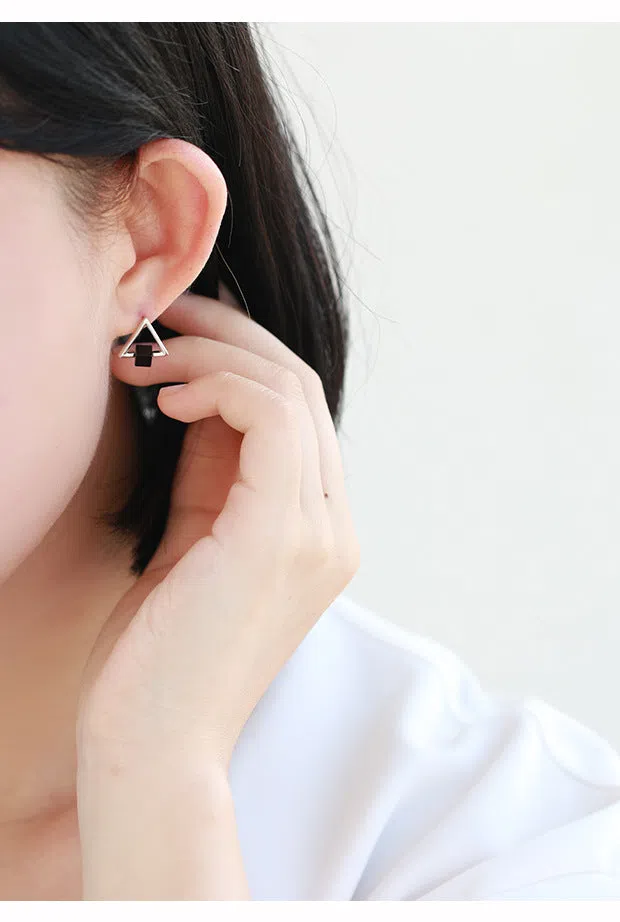 Sterling silver S925 geometric triangle black earrings with gem inlay on neutral background