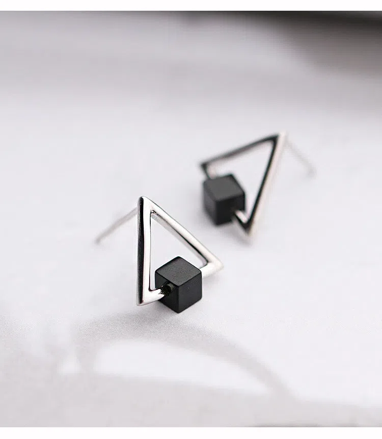 Sterling silver S925 geometric triangle black earrings with gem inlay on neutral background