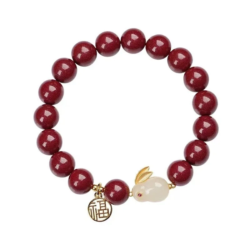 Purple gold sand cinnabar bracelet with jade hare charm in 6mm and 8mm bead sizes