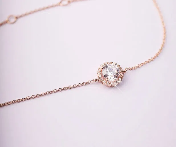 Round crystal anklet on ankle, rose gold tone with alloy and silver or gold plating, 22cm chain plus 4cm extender