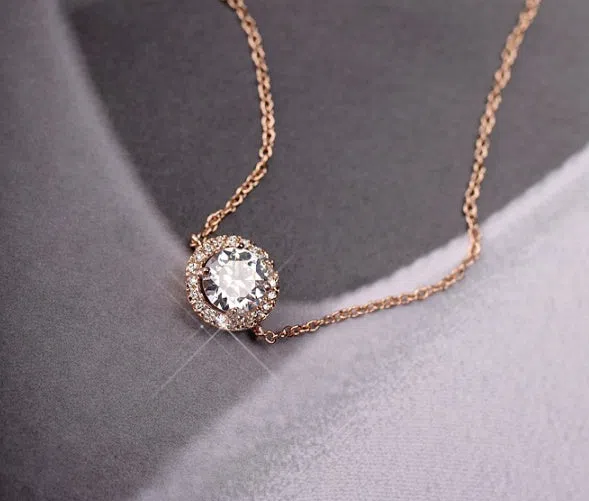 Round crystal anklet on ankle, rose gold tone with alloy and silver or gold plating, 22cm chain plus 4cm extender