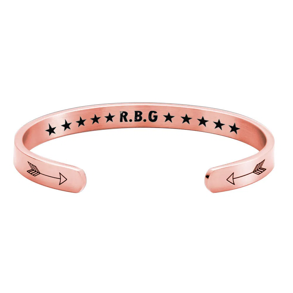 Stainless steel C-shaped RBG Ginsburg bracelet in gold, rose gold, and silver colours on wrist