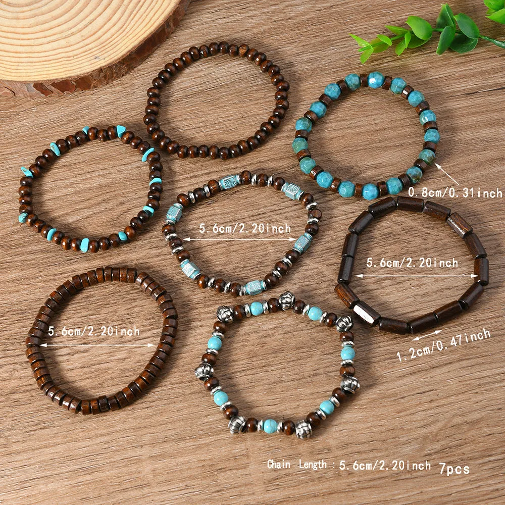 Set of seven multicolour retro bracelets with wooden beads and alloy accents laid flat.