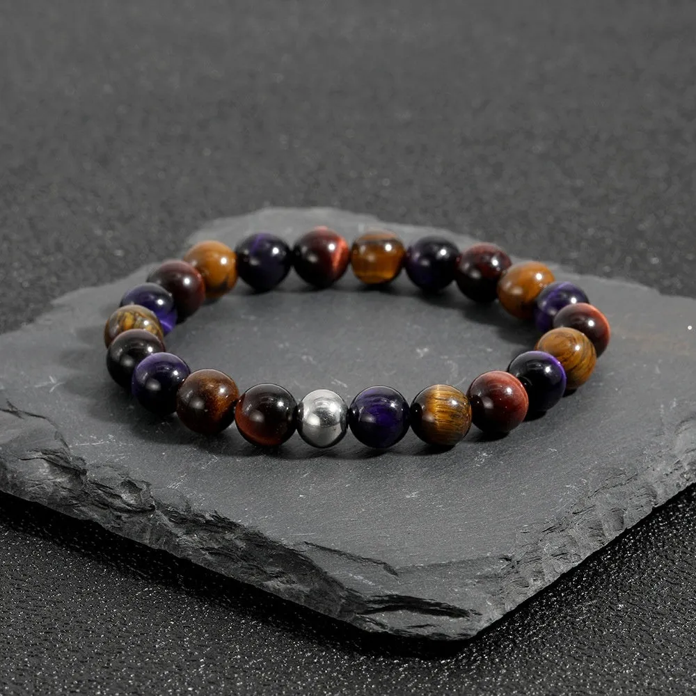 Handmade elastic bracelet with yellow, purple, and red natural tiger-eye stone beads in a geometry shape.