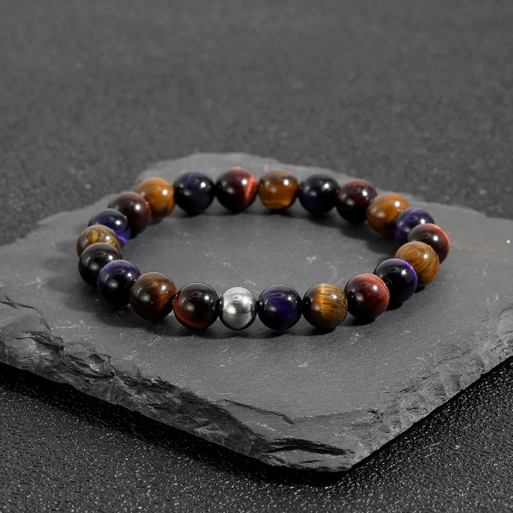 Handmade elastic bracelet with yellow, purple, and red natural tiger-eye stone beads in a geometry shape.