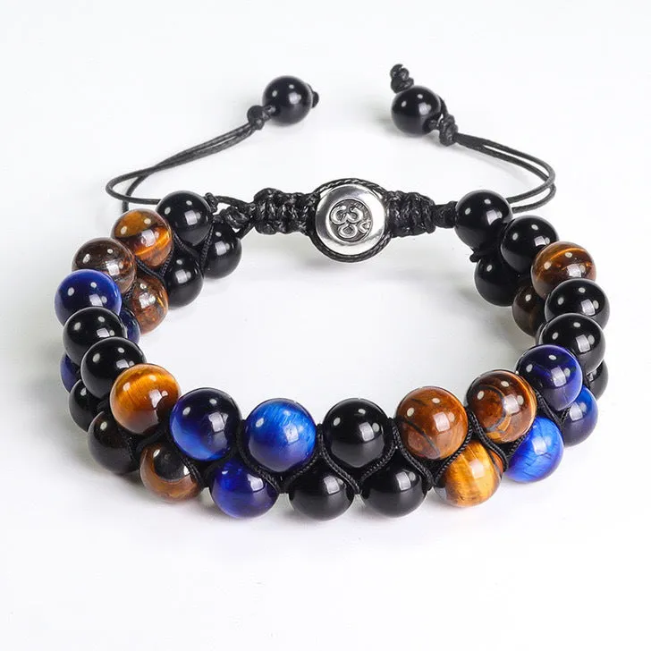 Men's black and gold tiger eye stone woven bracelet with magnetic clasp showing geometric pattern