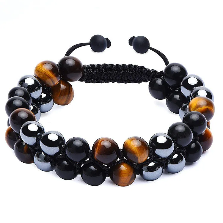 Men's black and gold tiger eye stone woven bracelet with magnetic clasp showing geometric pattern