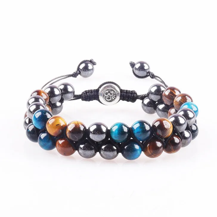 Men's black and gold tiger eye stone woven bracelet with magnetic clasp showing geometric pattern