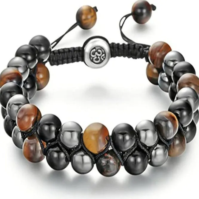 Men's black and gold tiger eye stone woven bracelet with magnetic clasp showing geometric pattern