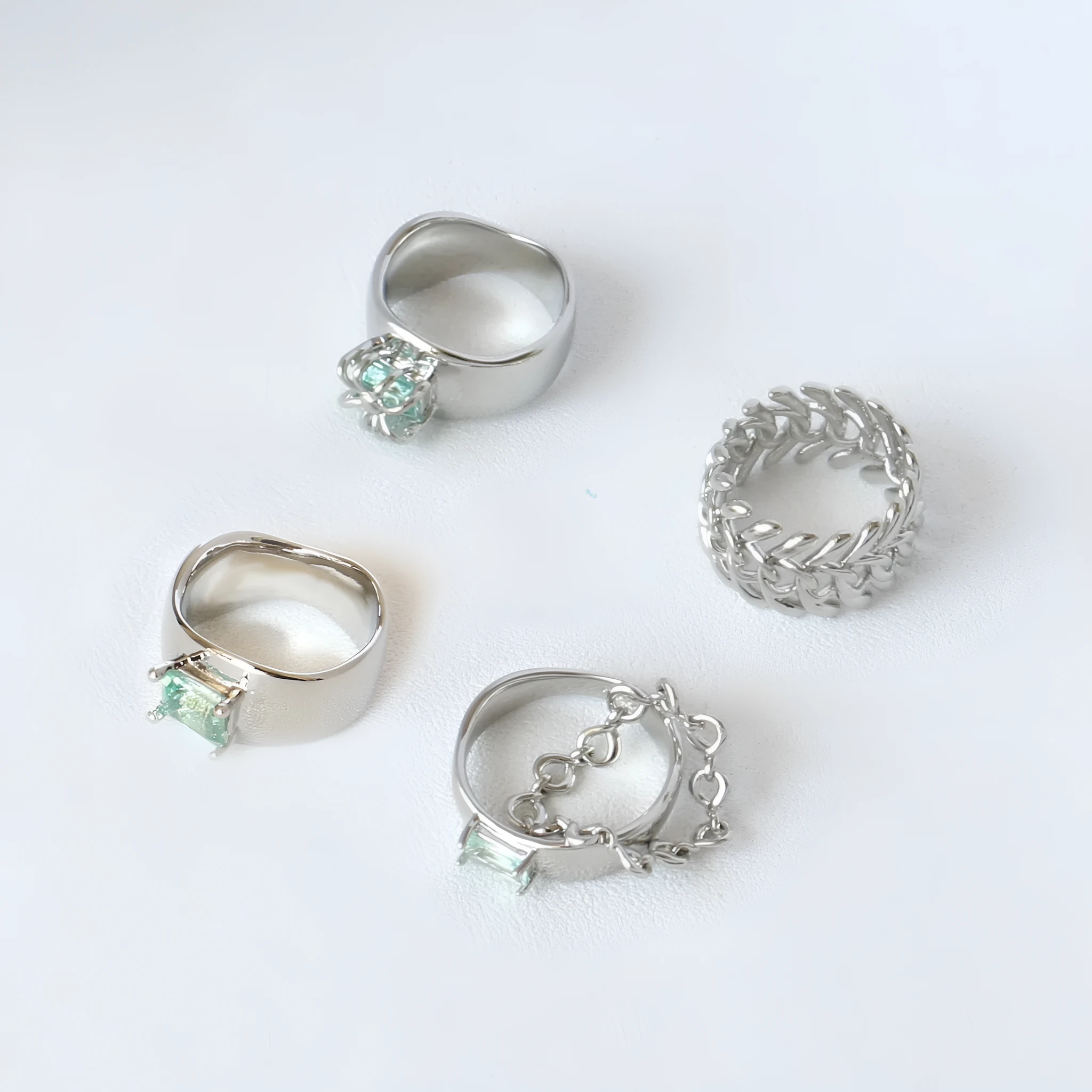 Copper platinum plated couple ring with three-ring gem design in style A on a neutral background