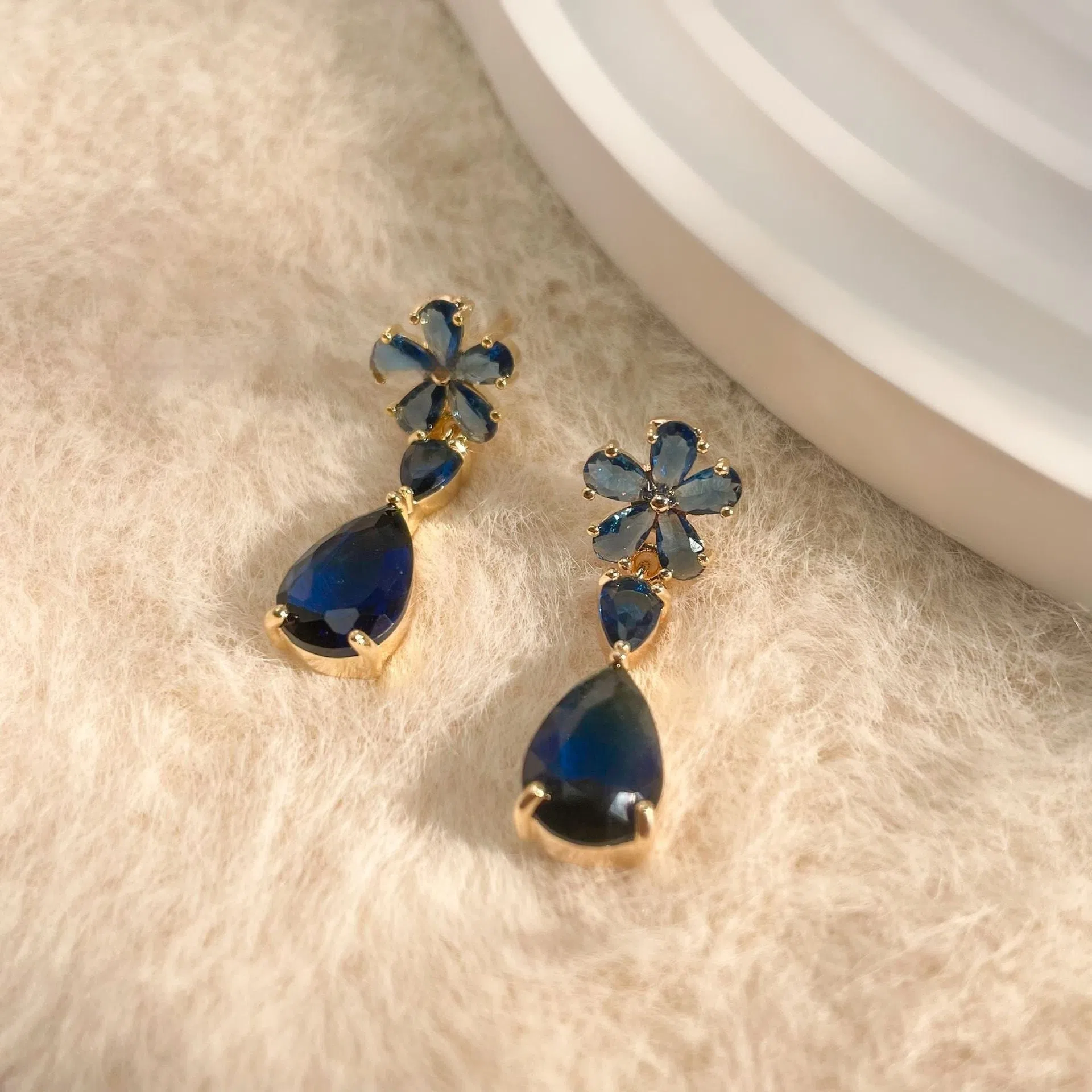 Copper stud earrings flower tassel design multi-colour electroplated geometric simple style on white background