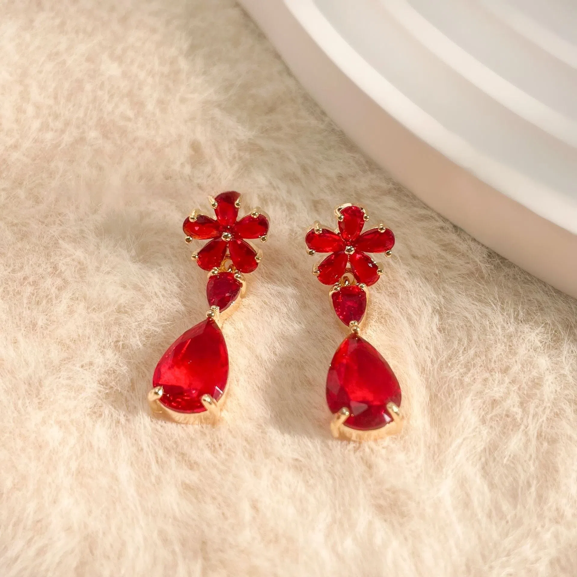 Copper stud earrings flower tassel design multi-colour electroplated geometric simple style on white background
