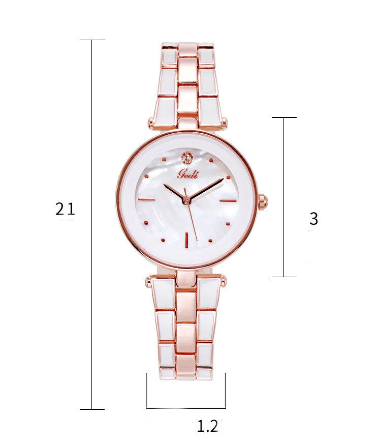 White dial ladies quartz watch with rose gold accents, steel strap, 30mm round alloy case on flat surface
