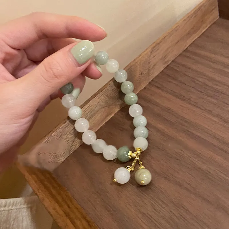 Women's white multi-layer beaded bracelet with rice-shaped and round beads in ethnic vintage style.