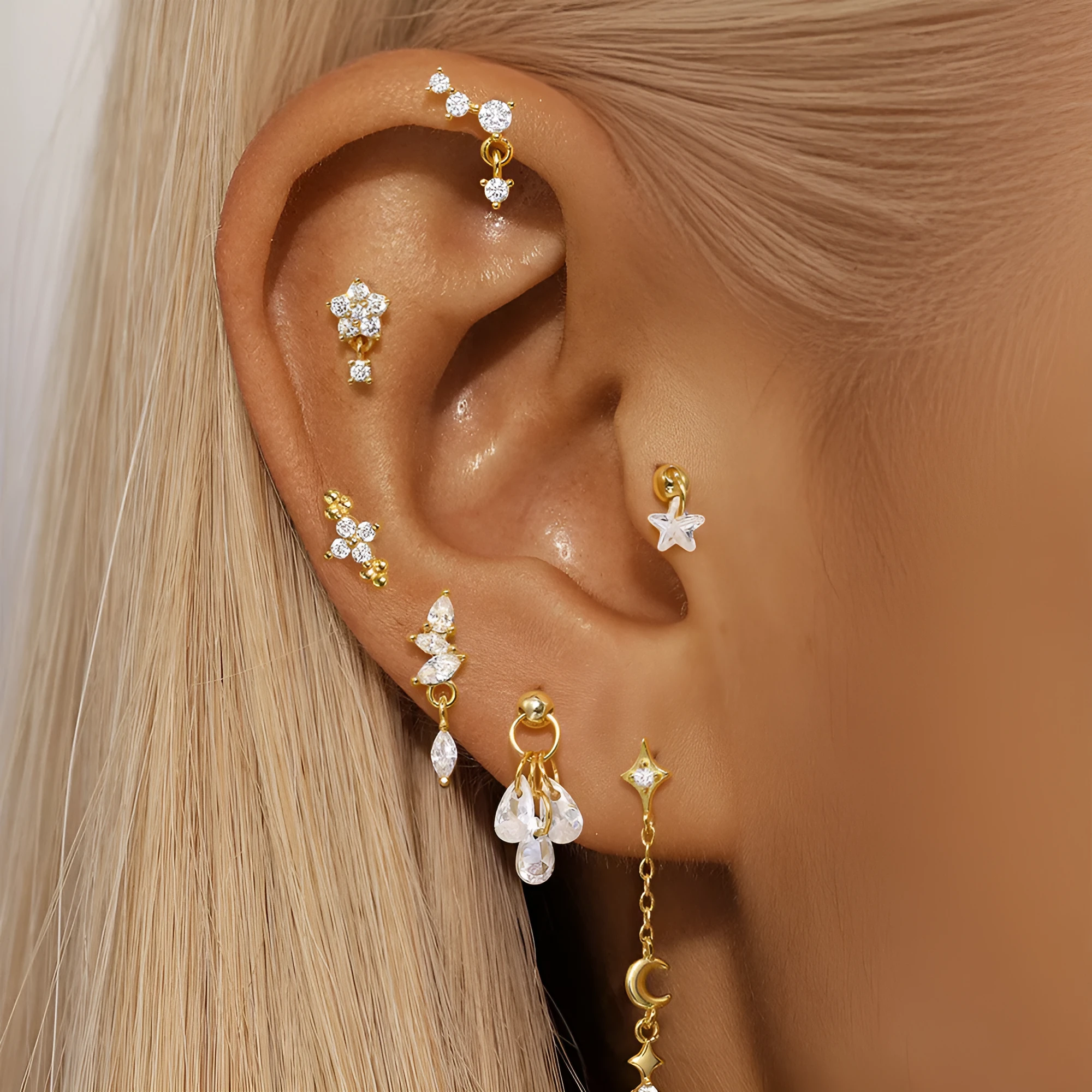 S925 sterling silver geometric earrings with a moon and embedded diamond star design in a gold-toned finish.