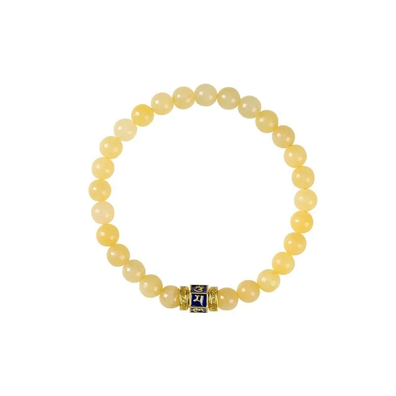 Women's hand-woven topaz bracelet with mantra barrel beads, square sugar beads, and fu charm in yellow jade