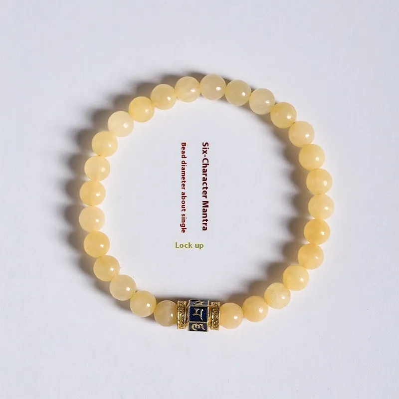 Women's hand-woven topaz bracelet with mantra barrel beads, square sugar beads, and fu charm in yellow jade
