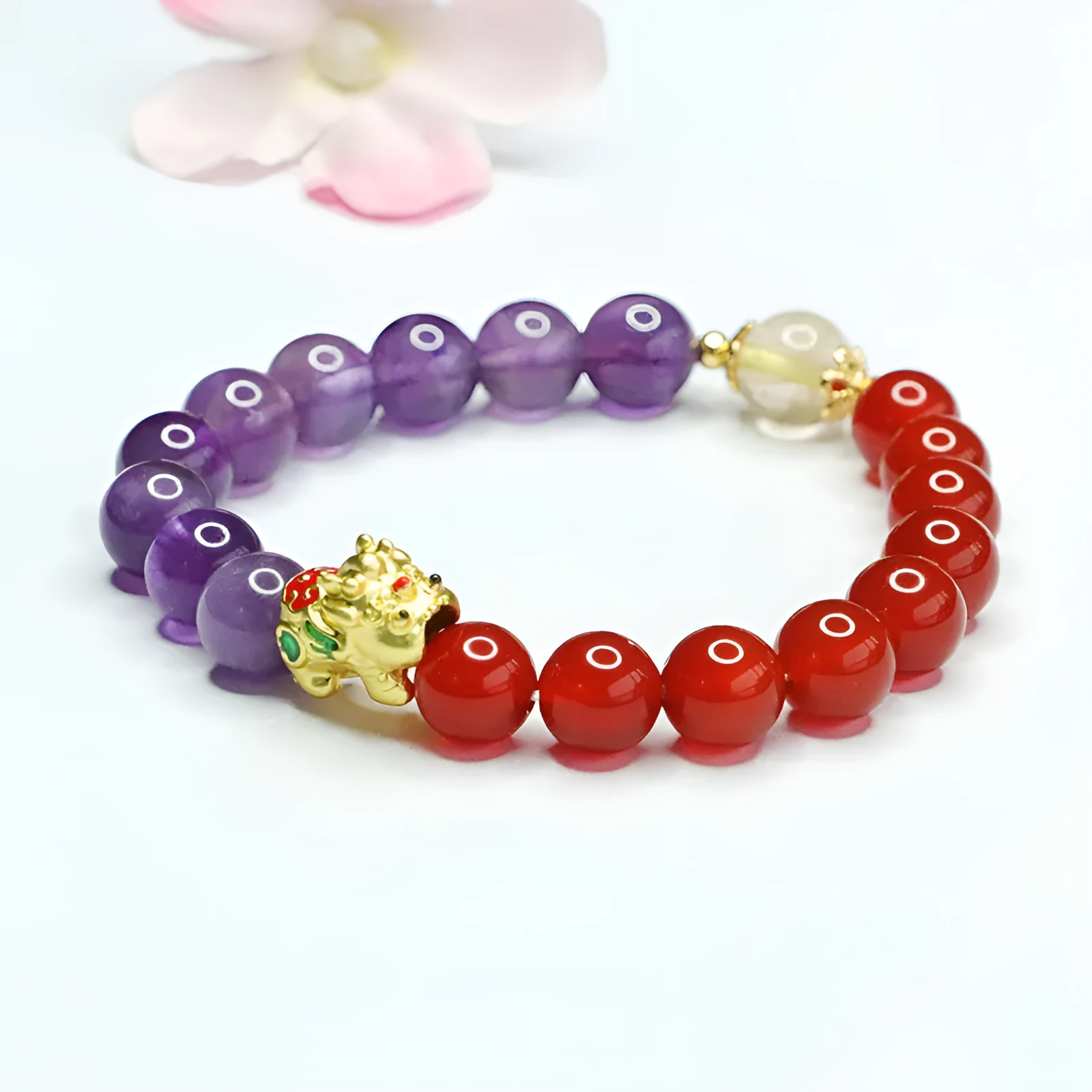 Purple amethyst and red agate beaded bracelet with Chinese style design on wrist