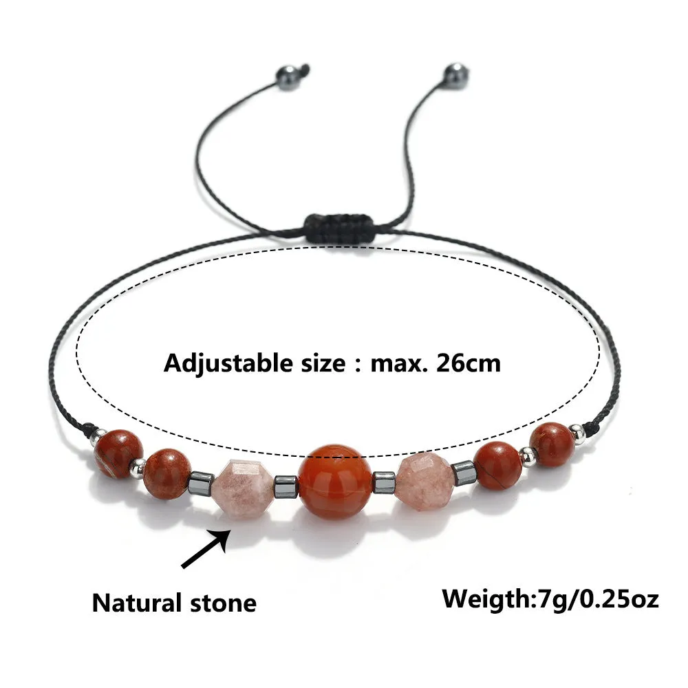 Handmade red geometric bracelet with sunstone, redstone, and copper beads.
