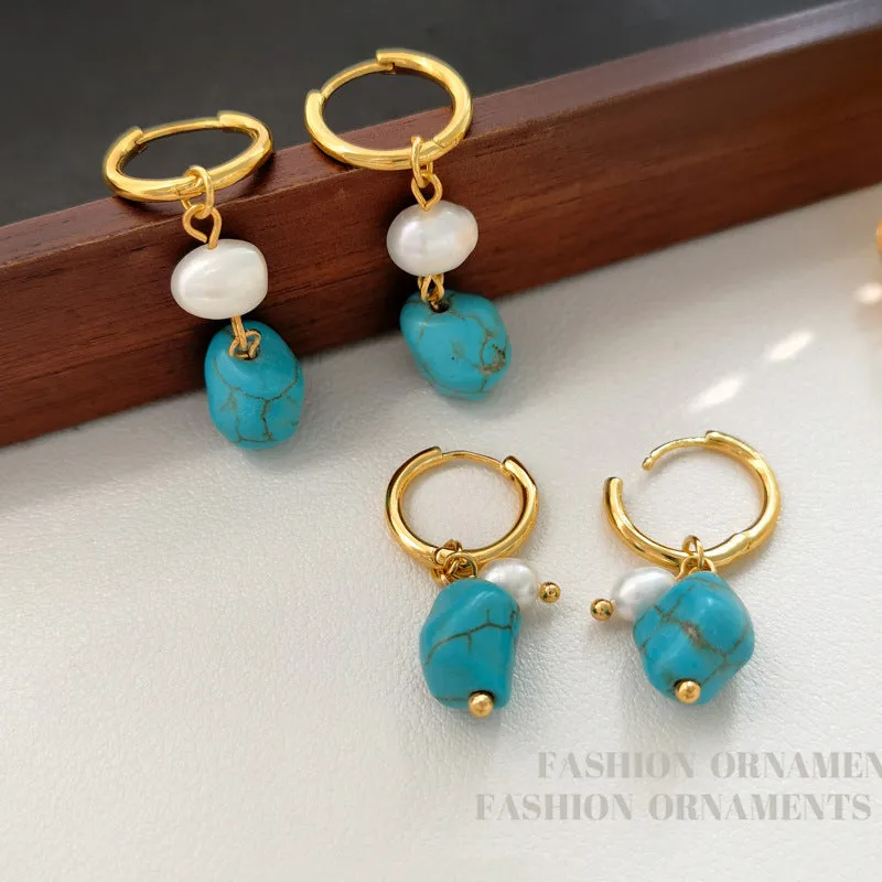 A pair of geometric copper ear clips with irregular turquoise stone and cultured pearls, showing both short and dangle styles.