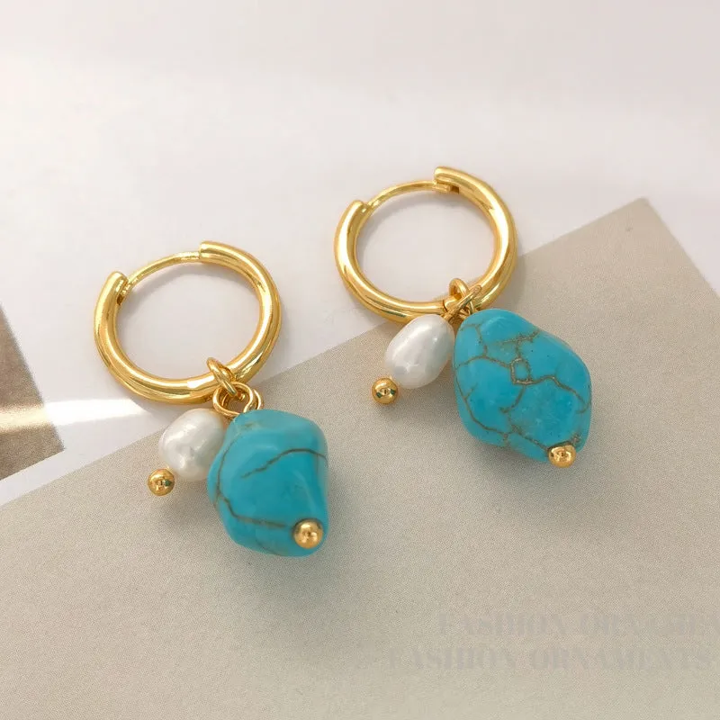 A pair of geometric copper ear clips with irregular turquoise stone and cultured pearls, showing both short and dangle styles.