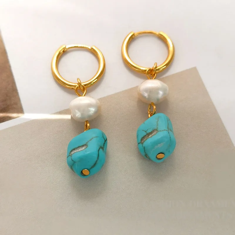 A pair of geometric copper ear clips with irregular turquoise stone and cultured pearls, showing both short and dangle styles.
