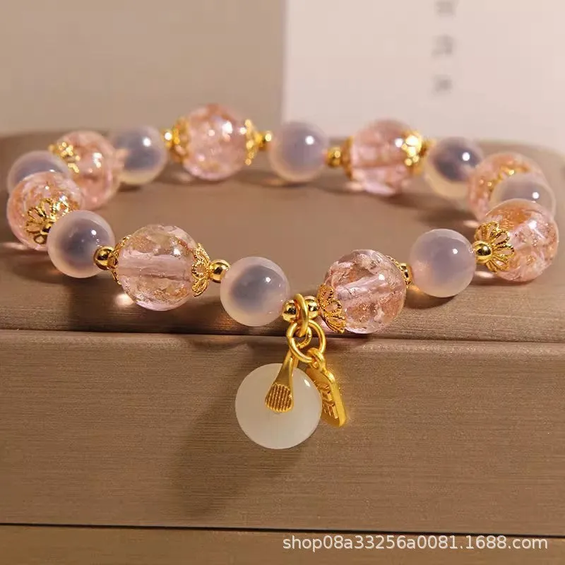 Women's pink heart agate bracelet with peace buckle closure and luminous glaze details