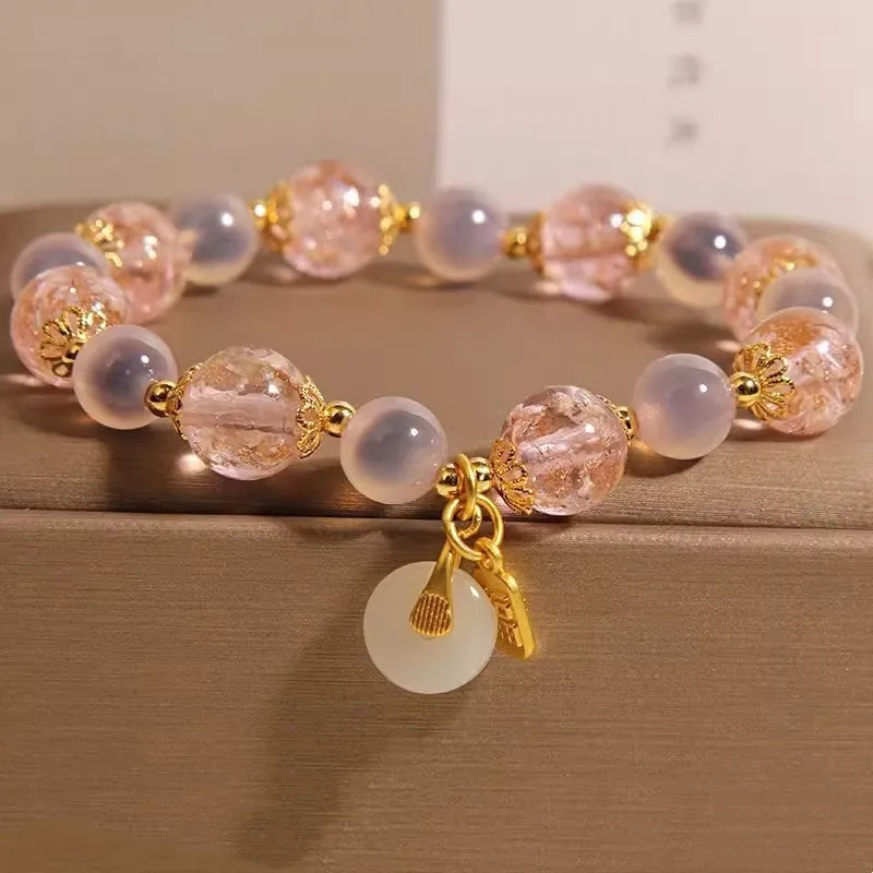 Women's pink heart agate bracelet with peace buckle closure and luminous glaze details
