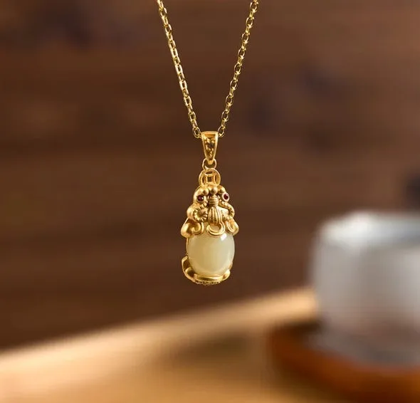 Hetian jade antique gold pendant necklace with cartoon pi xiu design and cross chain.
