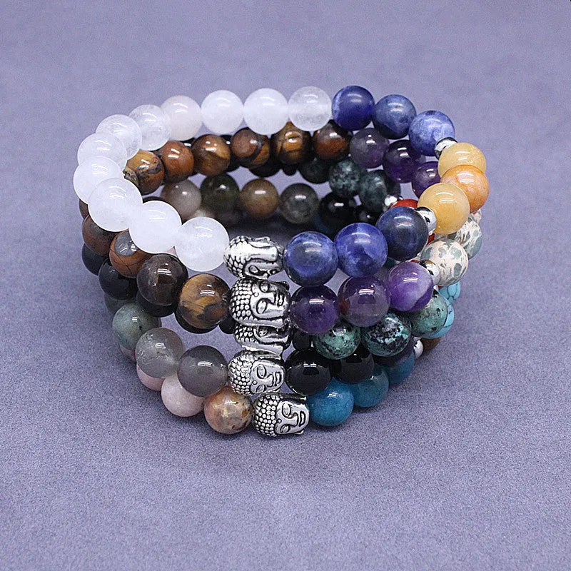 Natural stone elastic bracelet in a mixed colour pattern on a wrist.