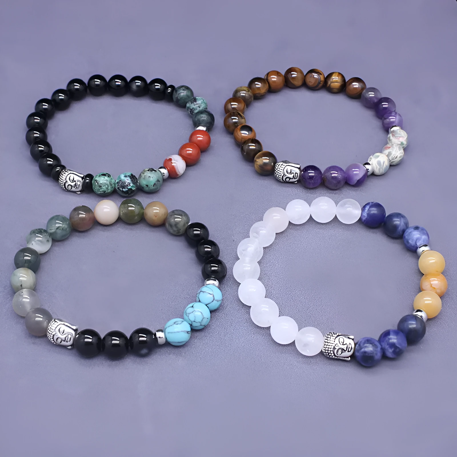 Natural stone elastic bracelet in a mixed colour pattern on a wrist.