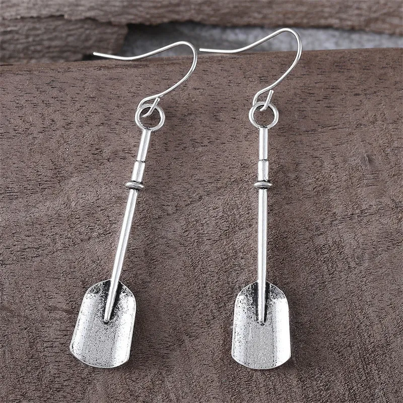 Long geometric shovel-shaped earrings with ancient silver finish and ethnic styling