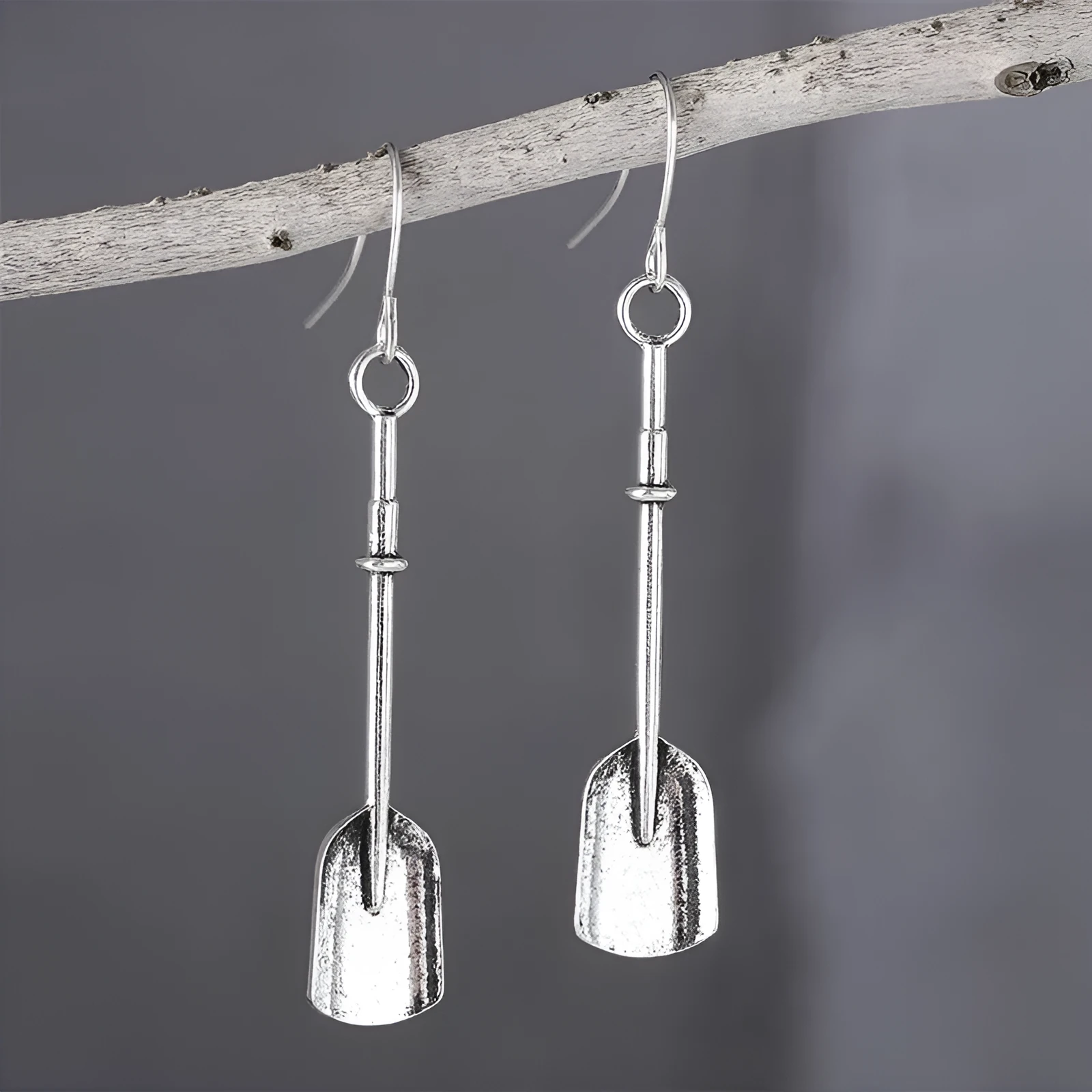 Long geometric shovel-shaped earrings with ancient silver finish and ethnic styling