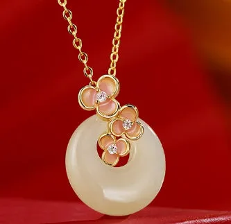 Peach blossom Hetian jade bracelet and necklace set with flower-shaped beads in sterling silver setting
