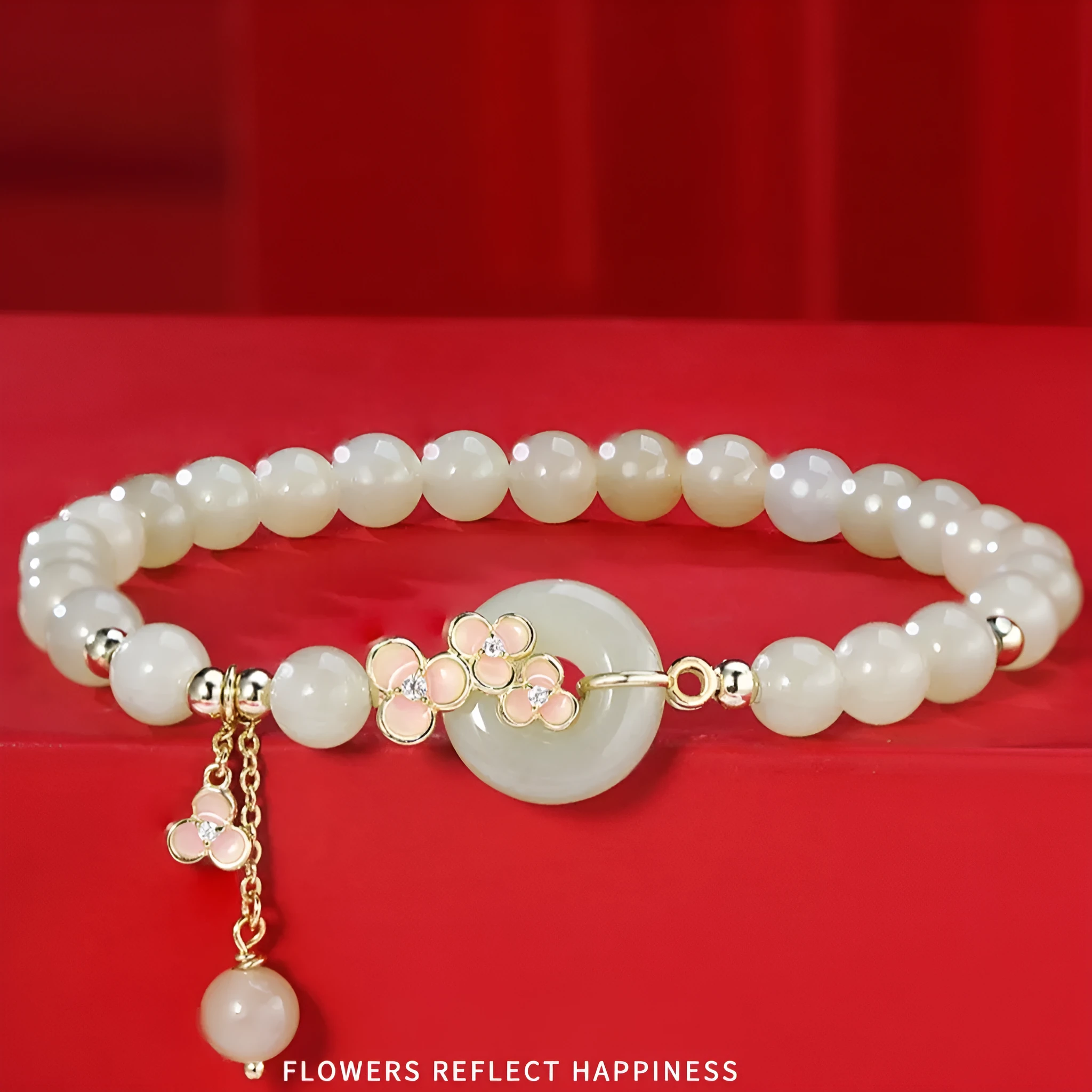 Peach blossom Hetian jade bracelet and necklace set with flower-shaped beads in sterling silver setting