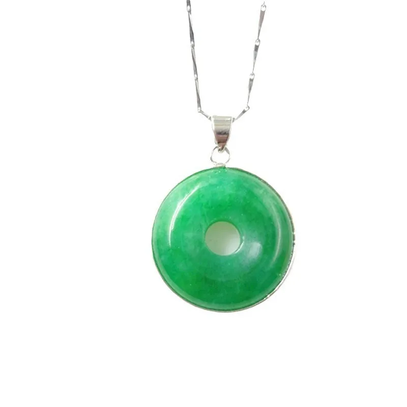 Emerald round jade pendant with gold inlaid safety buckle, modern simple geometry style, on a neutral background